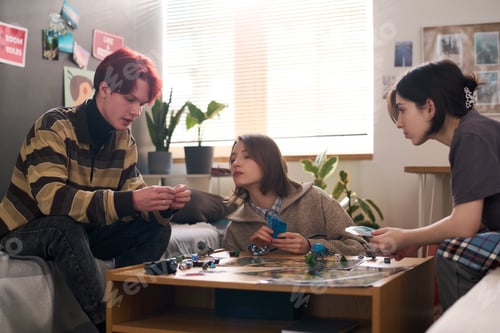 Preview: Friends Playing Board Games And Holding Cards
