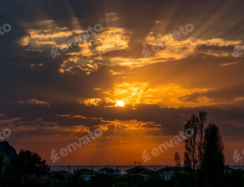 Preview: Golden sunset on the Greek island of Lesbos. Sun setting over the sea on Greek vacation destination.