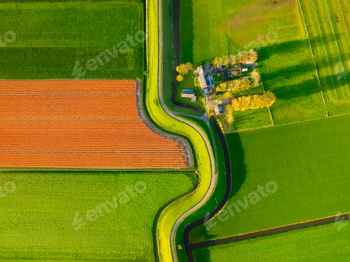Preview: An aerial view of a road with curves. Road through the field. Image for wallpaper, background.
