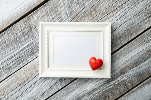 Preview: Love Valentine's Day concept. Blank picture frame and heart.