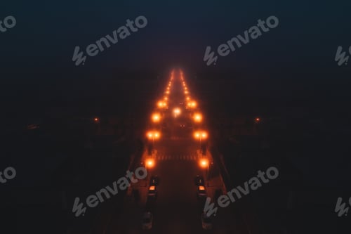 Preview: Road lit by street lamps shrouded in fog