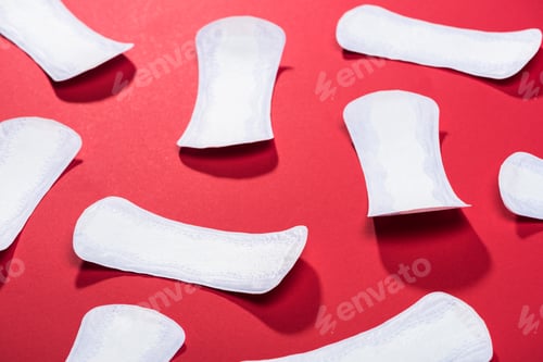 Preview: scattered protective daily pads on red