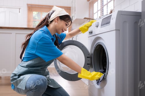 Preview: Woman Cleaning Washing Machine in Laundry Room