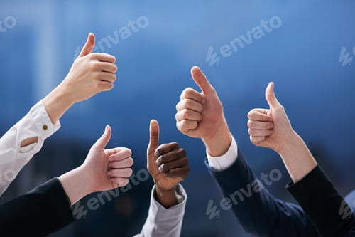 Preview: Teamwork trumps all. Shot of a group of office workers giving thumbs up together.
