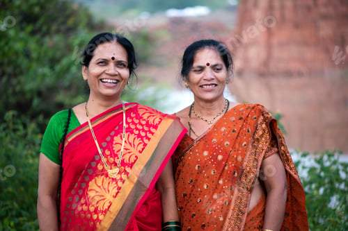 Preview: Happy Indian woman in traditional clothes at outdoor.