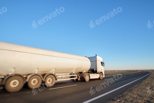 Preview: Petrol cargo truck driving on highway hauling oil products. Delivery transportation and logistics