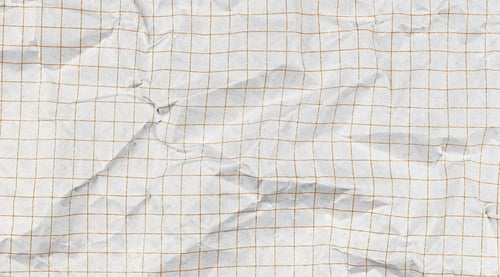 Preview: Wrinkled graph sheet with square cell pattern. Blue-tinted checkered texture ideal for educational