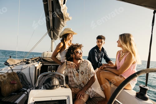 Preview: Friends enjoying relaxing sailing trip on sailboat in ocean