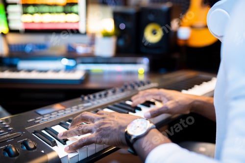 Preview: Man Plays Keyboard Synthesizer in Music Recording Studio