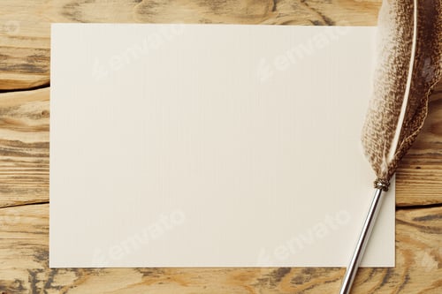 Preview: Old paper on brown wood background with feather