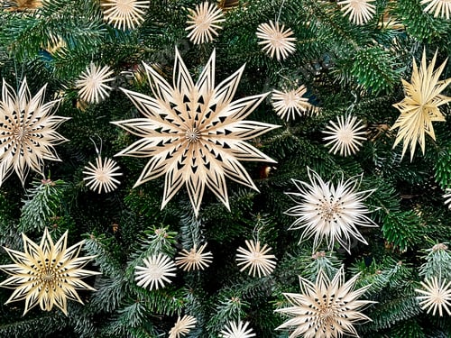 Preview: Golden Star Shaped Christmas Tree Decorations On Green Branches Of Christmas Tree