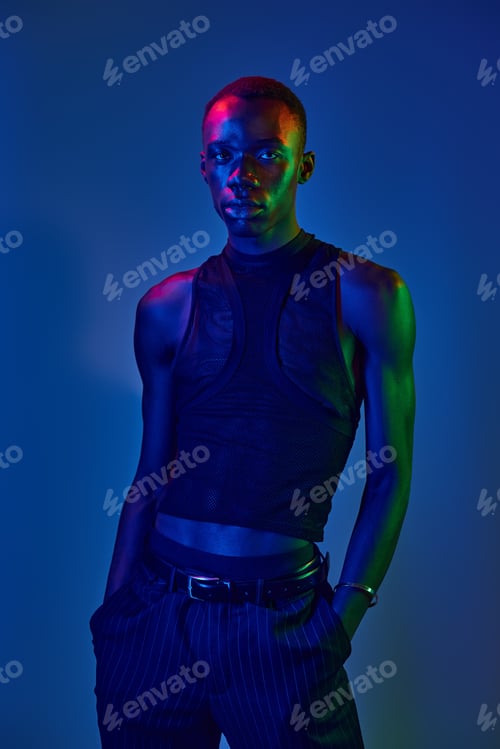 Preview: Vibrant young man showcasing modern style with striking colors and confident pose