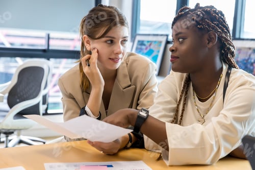 Preview: Diverse colleagues gather in brainstorm discuss statistics together.