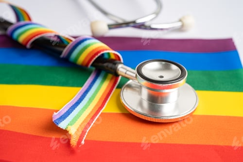 Preview: stethoscope on rainbow flag background, symbol of LGBT pride month celebrate annual in June.