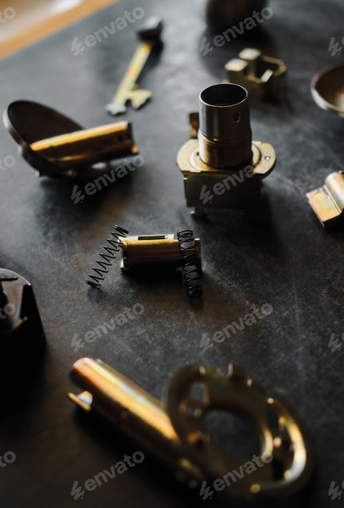 Preview: The parts of the door lock on the black floor