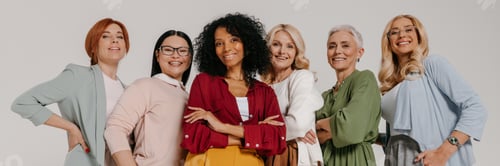 Preview: Group of elegant mature women bonding and smiling against grey background