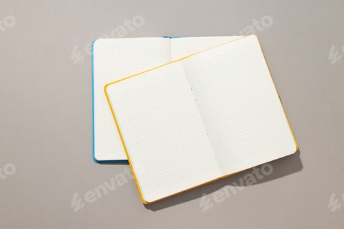 Preview: Open notebooks lie on a light background