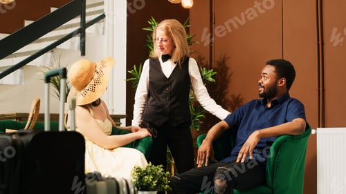 Preview: Resort employee chatting with people