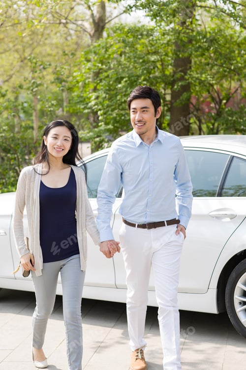 Preview: Happy young couple and car