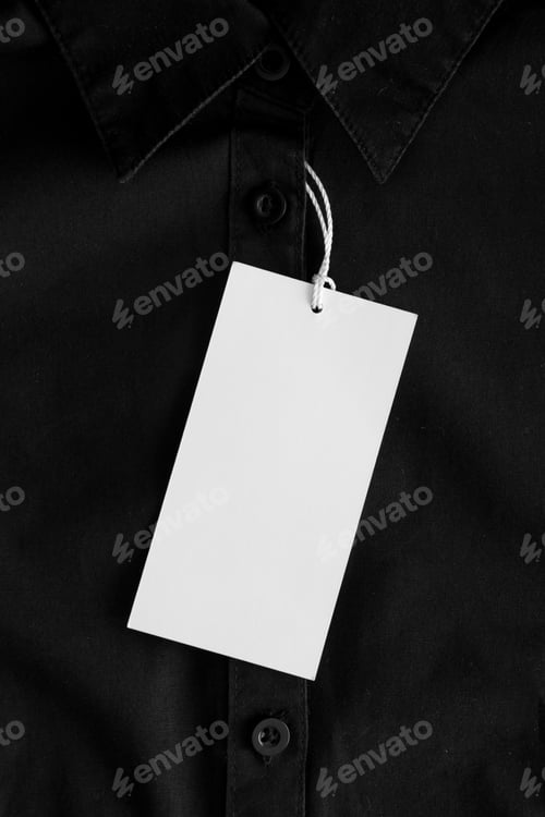 Preview: White clothing tag mockup on a black shirt.