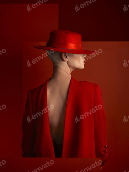 Preview: Back, fashion and space with a woman on a red background in studio for marketing, advertising or br