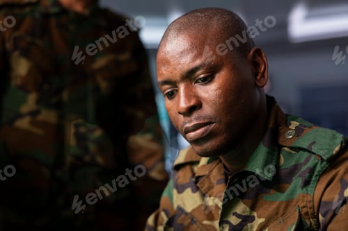 Preview: Military soldier wearing camo uniform in mission control center