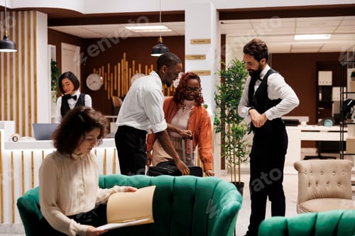 Preview: Hotel concierge assisting guests