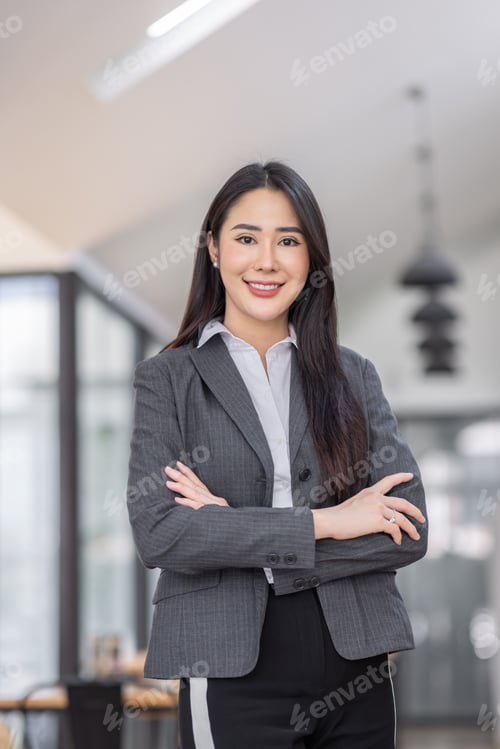 Preview: Portrait of successful business asian women in suit with arms crossed and smile isolated over white