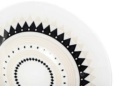 Preview: Stylish decorative plate with black and white geometric patterns on display