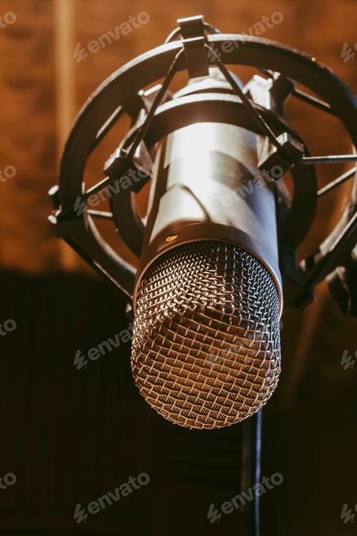 Preview: close-up of a vintage microphone with a warm background