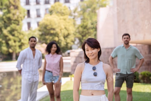Preview: Group of young people posing in the city park