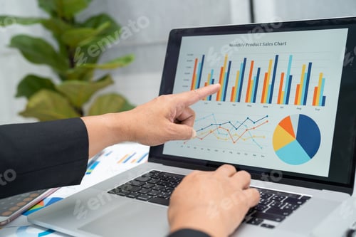 Preview: Asian accountant working and analyzing financial reports project accounting with chart graph