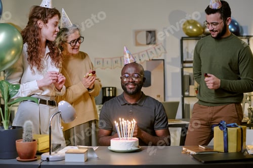 Preview: Middle Aged Black Man Smiling While Celebrating Birthday with Friends