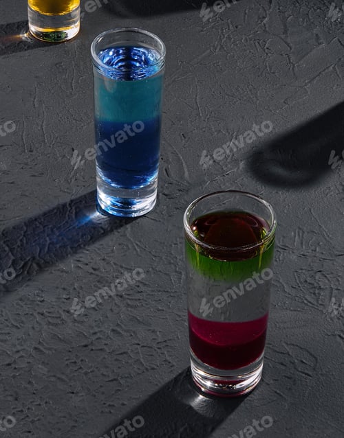Preview: Multicolored shots on dark stone