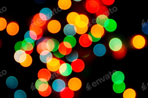 Preview: blurred defocused christmas lights bokeh on a black background