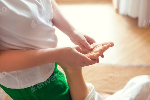 Preview: Young woman having massage treatment