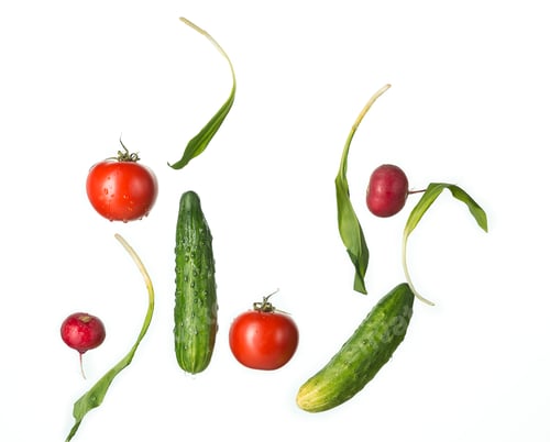 Preview: The fresh tomatos, cucumbers, radish in spray of water.