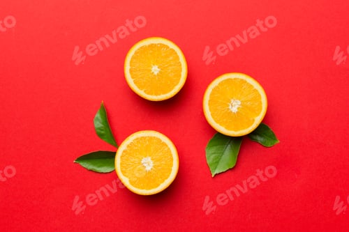Preview: Fruit pattern of fresh orange slices on colored background. Top view. Copy Space