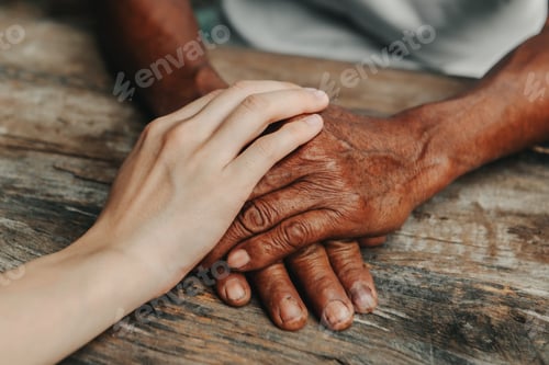 Preview: Young man holding senior woman hands, closeup