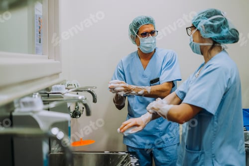 Preview: Unrecognizable doctor washing hands before operating