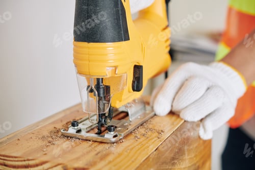 Preview: Cutting Wood with a Yellow Jigsaw in Workshop