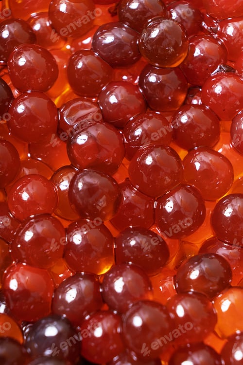 Preview: Close up of caramel balls for making bubble tea. Bubbles background.