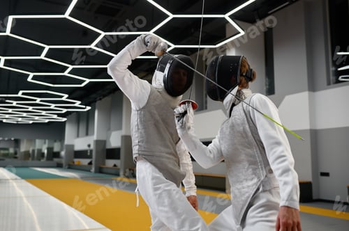 Preview: Two fencers crossed swords before fight, closeup shot of fencing dual start