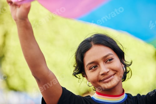 Preview: Rainbow, flag and gay pride with an indian woman in a city in celebration of lgbt equality or freed