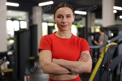 Preview: Portrait of professional personal trainer in gym