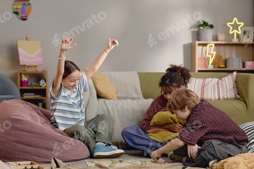 Preview: Multiethnic Generation Alpha Children Playing Board Game Indoors
