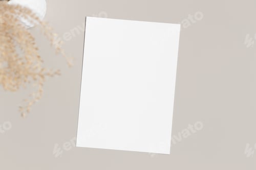 Preview: White invitation card mockup with a dried grass on a beige table. 5x7 ratio, similar to A6, A5.