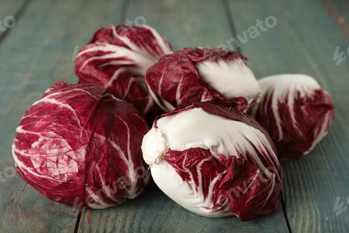 Preview: Whole fresh ripe radicchios on blue wooden table