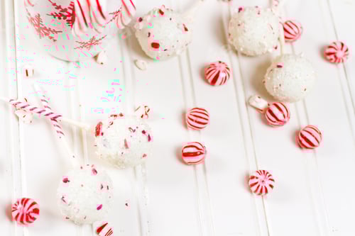 Preview: Festive Peppermint Candies and Cake Pops on White Wood