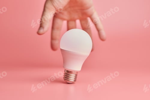 Preview: Light bulb and hand, idea catching concept. Symbol of new events or finding solutions to problems